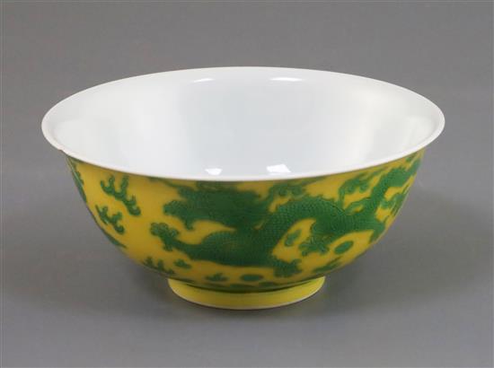 A Chinese yellow and green enamelled dragon bowl, Qianlong seal mark and of the period (1736-95) D. 15.5cm, faults